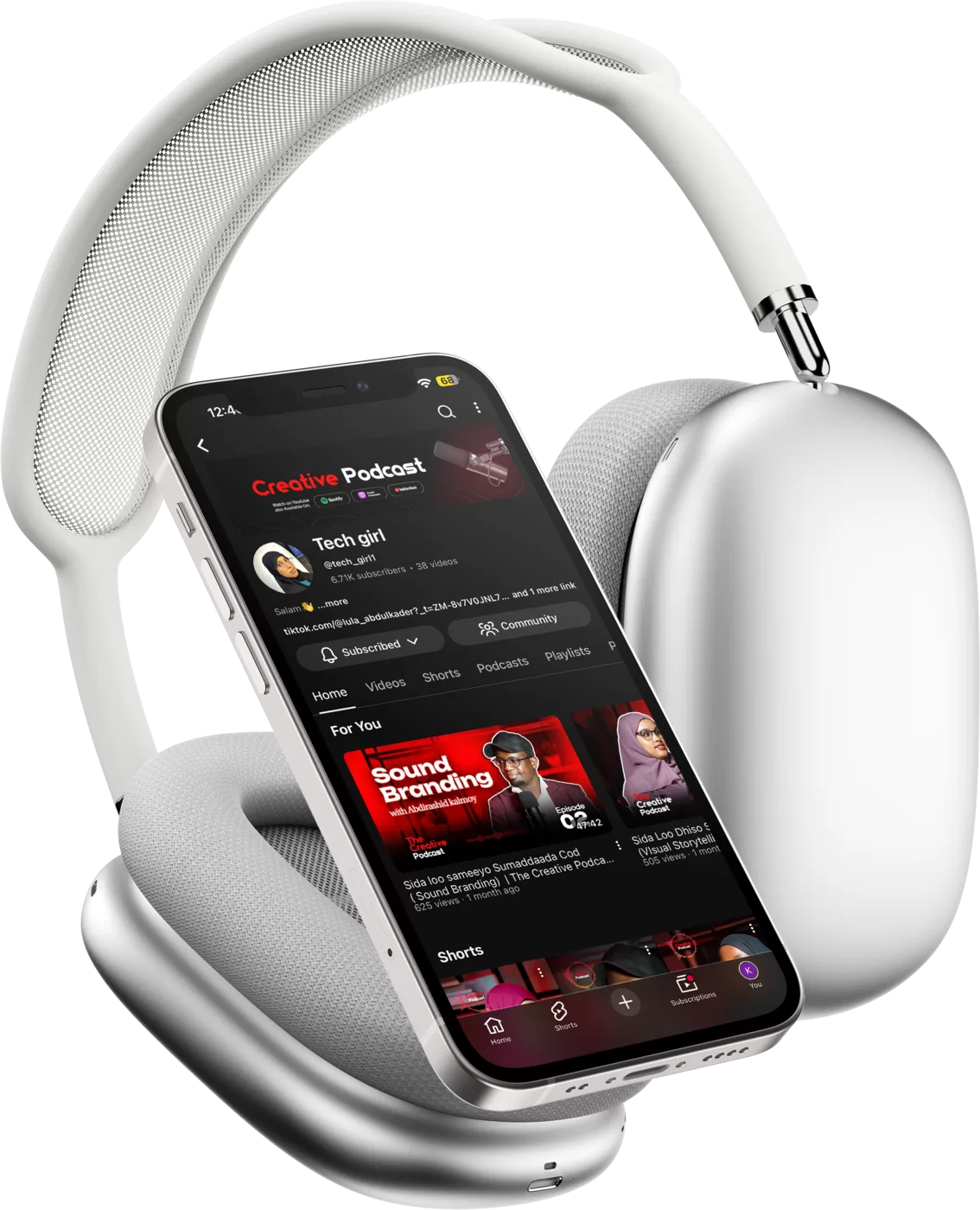 The Creative Podcast YouTube channel on a phone resting against over ear headphones